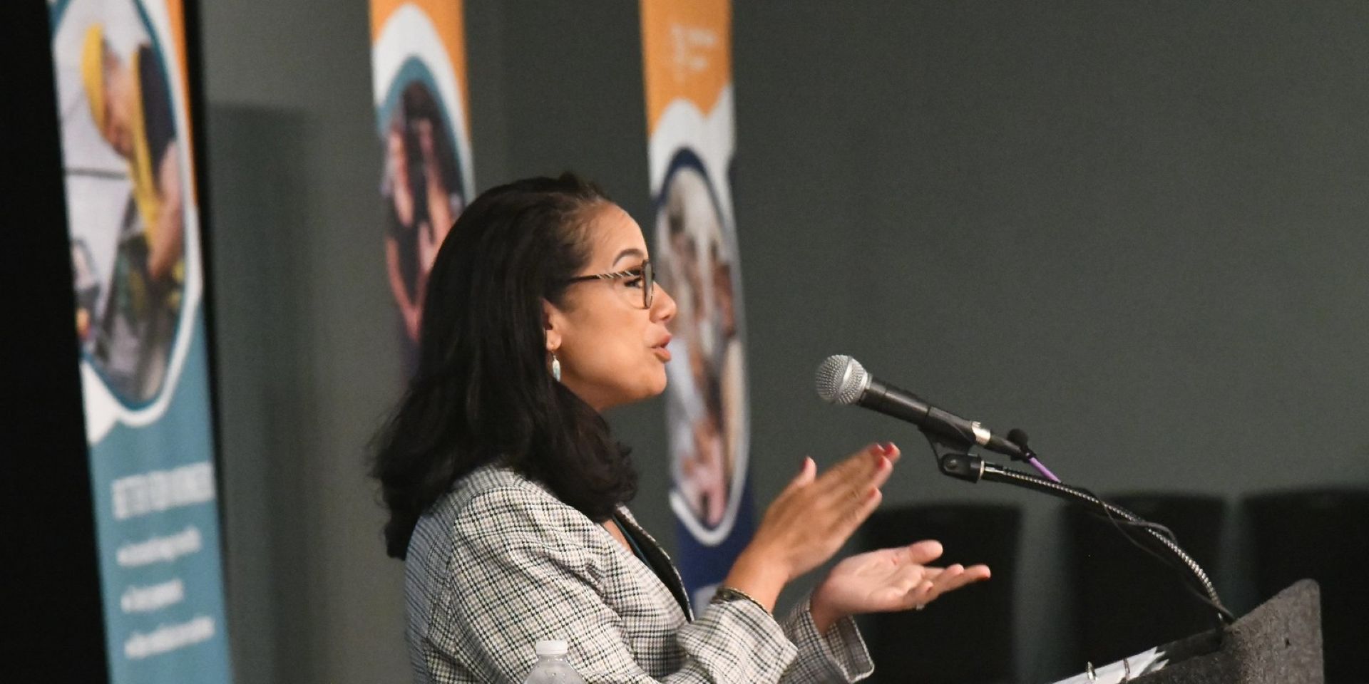 Clarissa M. Rodriguez speaking at a leadership forum